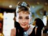 The Timeless Elegance of a Classic Black Dress, White Pearls, and Red Lipstick