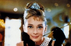 The Timeless Elegance of a Classic Black Dress, White Pearls, and Red Lipstick